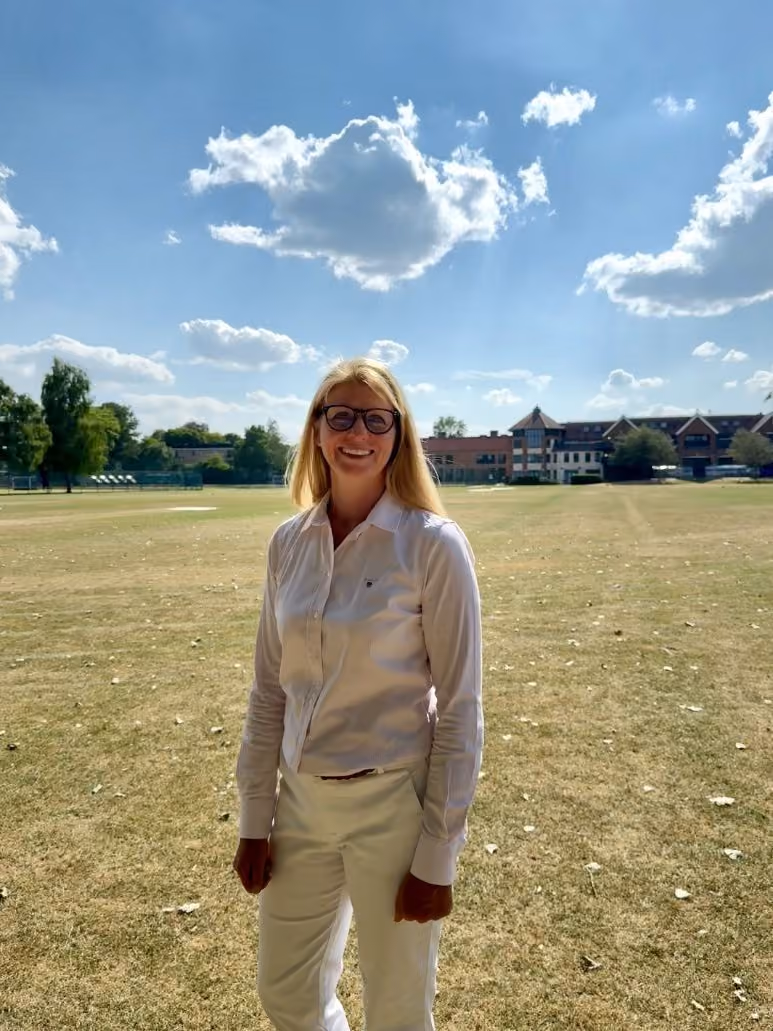 Shelley Smith standing on the playing fields at the Dragon School, Oxford